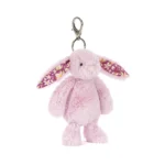 Front view of Jellycat Blossom Thistlepop Bunny Bag Charm with soft pastel purple fur, floral patterned ears and silver clasp attachment.
