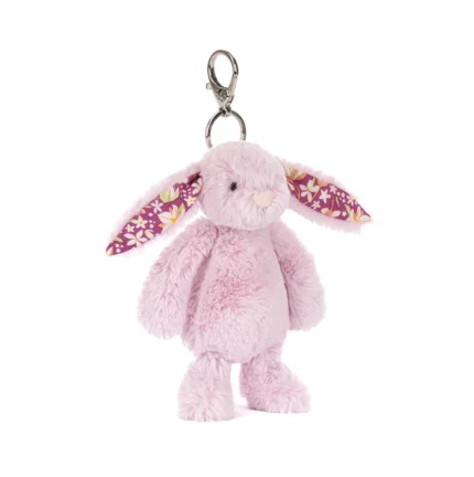 Front view of Jellycat Blossom Thistlepop Bunny Bag Charm with soft pastel purple fur, floral patterned ears and silver clasp attachment.