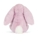 Rear view of Jellycat Blossom Thistlepop Luxe Bunny Original highlighting soft pastel purple plush, long ears and fluffy cream tail.