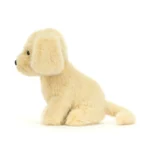 Side view of Jellycat Golden Puppy showing plush golden fur, floppy ear and long tail.