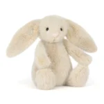 Front view of Jellycat Wheat Flufflet Bunny with soft wheat beige fur, floppy ears and fluffy cream tail.